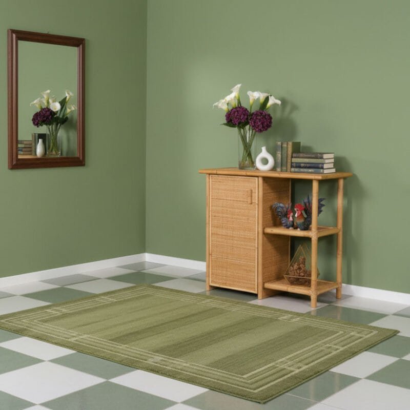 Stanza moderna con pareti verdi, mobile in legno, specchio e decorazioni floreali.