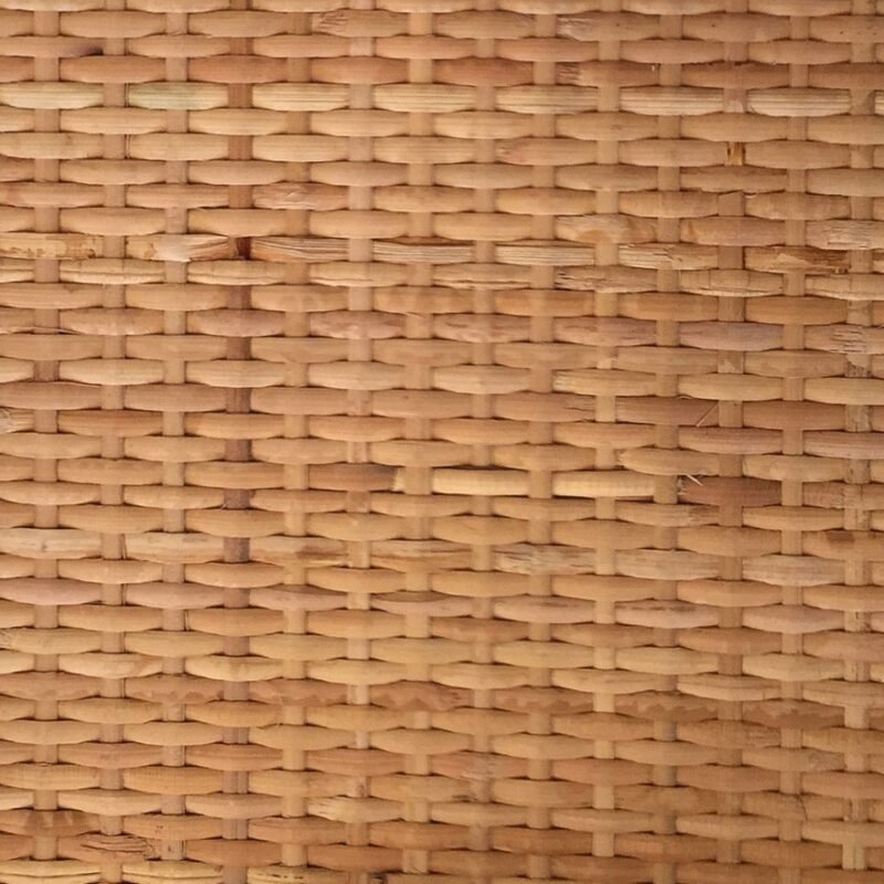 Close-up of a woven wicker basket pattern with natural tan fibers.