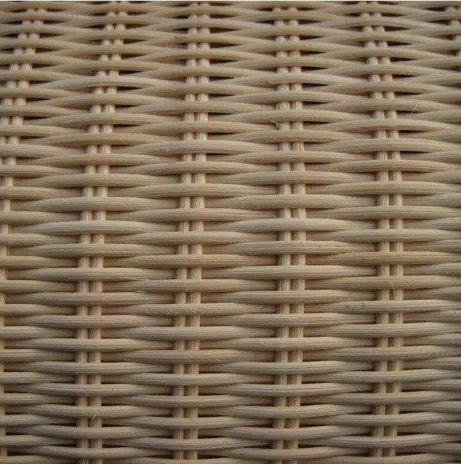 Tessuto midollino jollygiuncoeu close up of a woven wicker texture with light brown interlaced strands used in furniture