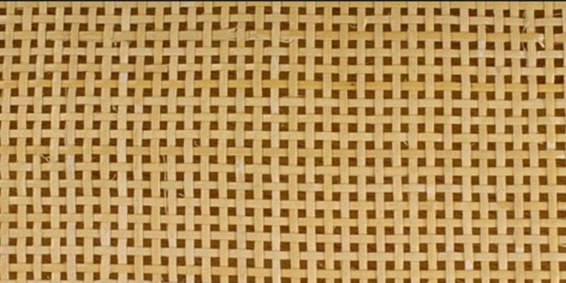 Close-up of a light brown woven lattice pattern, like a rattan mat or basket weave