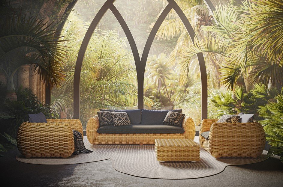 Bombo Divano 3 posti3 jollygiuncoeu wicker outdoor furniture with navy cushions on a sunlit tropical patio framed by arched windows