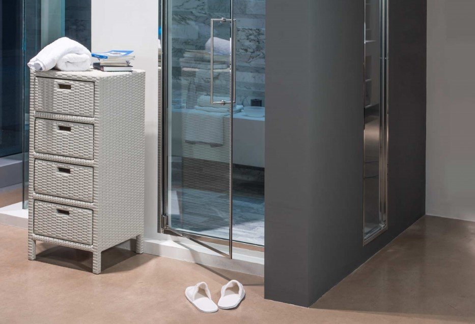 Cabinet modulo 4 cassetti2 jollygiuncoeu wicker white storage cabinet with folded towels on top beside a glass shower door in a modern bathroom slippers on the floor