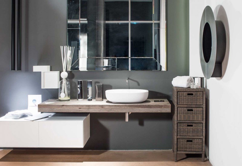 Cabinet modulo 4 cassetti3 jollygiuncoeu modern bathroom vanity with a white vessel sink on a floating wood countertop dark wall large mirrored panel and wicker drawers with towels nearby