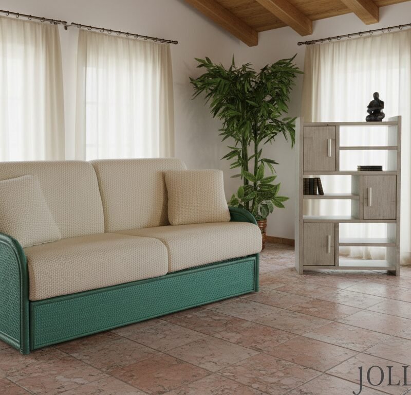 Cream-colored sofa with green wicker frame in a bright living room, with sheer white curtains and a tall potted plant nearby.