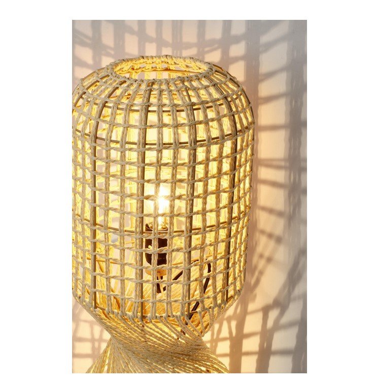 PIANTANA MALABO BEIGE H1044 jollygiuncoeu woven rattan lamp with a warm glowing bulb casting geometric lattice shadows on the wall likely as a decorative light fixture
