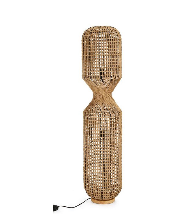 PIANTANA MALABO NATURALE H135 jollygiuncoeu tall woven rattan floor lamp with a knotted middle on a wooden base and plugged in for lighting