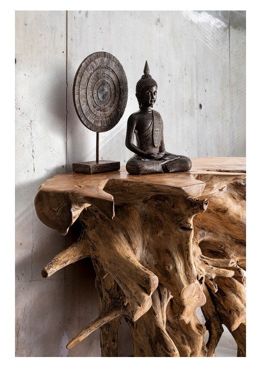 CONSOLLE SOLIDAD 120X40 2 jollygiuncoeu small buddha statue and circular carved disc on a weathered wooden driftwood table against a concrete wall minimalist decor