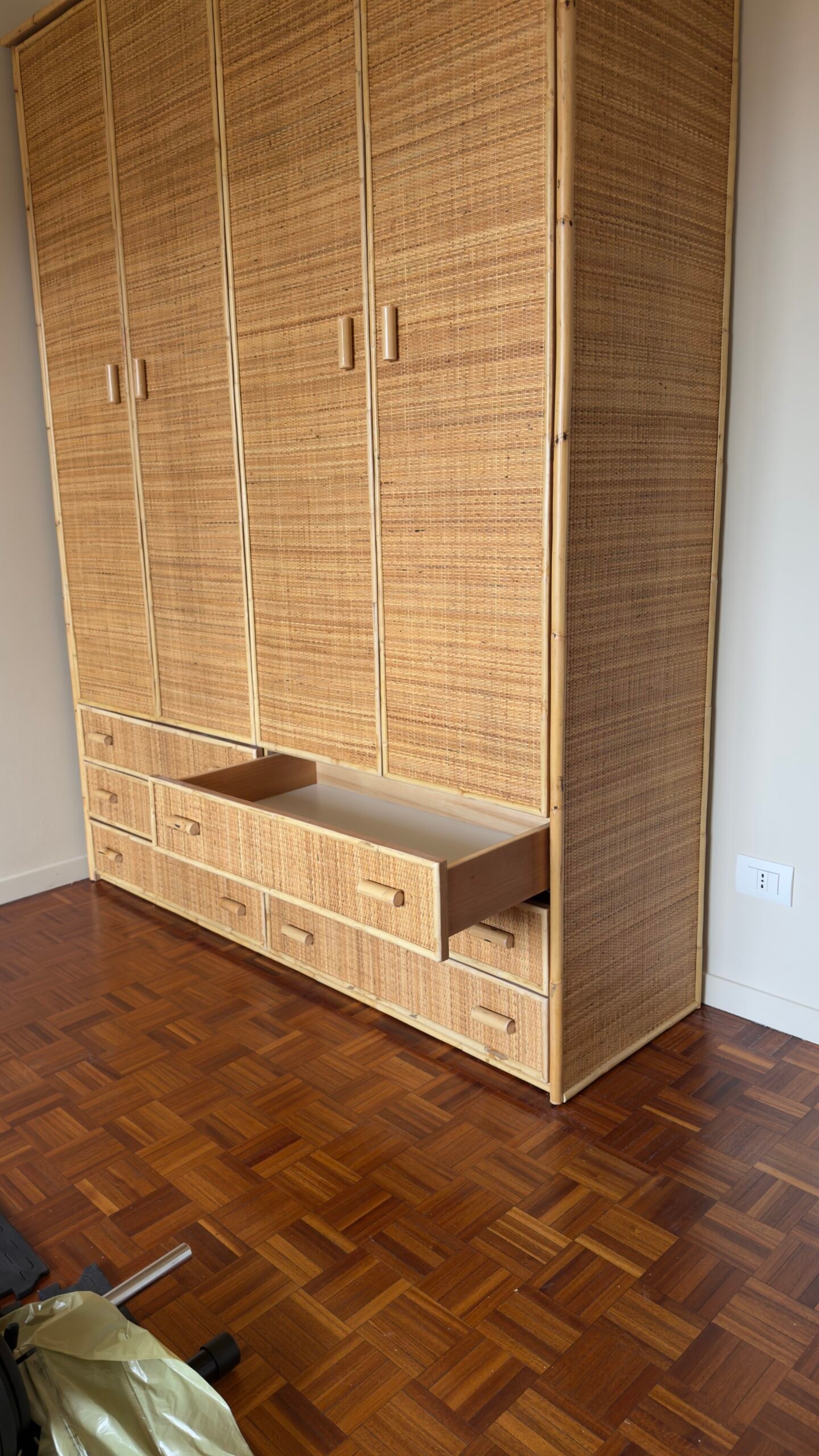 IMG2787 jollygiuncoeu tall woven rattan wardrobe with multiple doors and bottom drawers in a room with hardwood floor