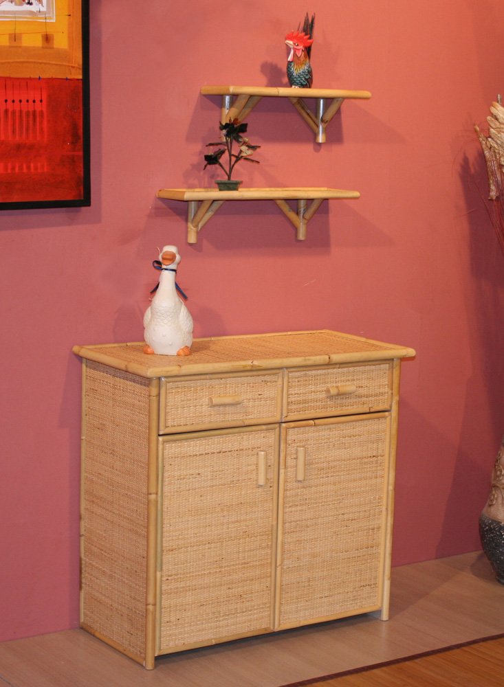 M221GRA jollygiuncoeu white ceramic duck with blue scarf sits on a woven bamboo cabinet against a pink wall two wall shelves hold a small plant and a red bird statue on top
