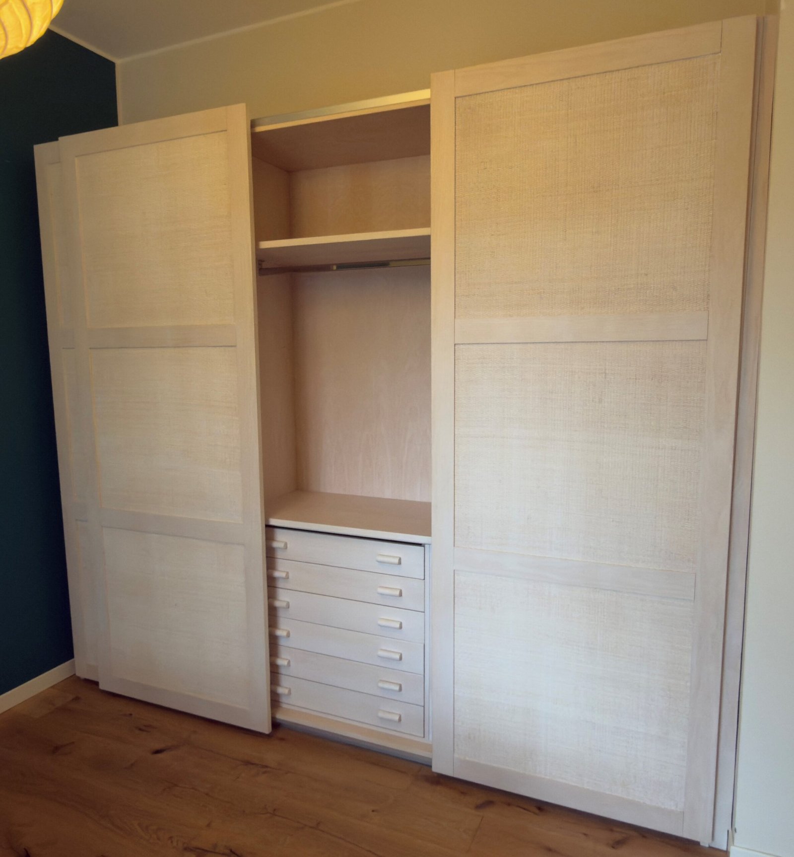 Armadio Erice a 3 Ante Scorrevoli con cassettiera9 2 jollygiuncoeu white wardrobe with two tall doors open center section showing shelves and six drawers at the bottom in a bedroom setting